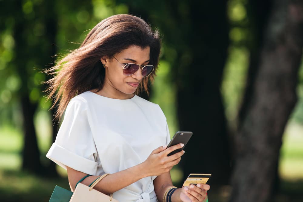 woman-sunglasses-cell-phone-credit-card.jpg