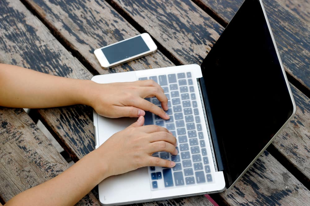 woman-writer-hands-typing-laptop.jpg